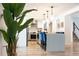 Open kitchen with island and breakfast bar, view of stairs at 18360 E Ithaca Pl, Aurora, CO 80013