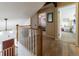 Upstairs hallway with hardwood floors and access to bedrooms at 18360 E Ithaca Pl, Aurora, CO 80013