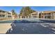 Seasonal pool with cover, surrounded by condo buildings and wrought iron fencing at 8225 Fairmount Dr # 105, Denver, CO 80247