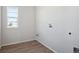 Laundry room with vinyl flooring and window at 24540 E 36Th Ave, Aurora, CO 80019