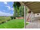 Lush backyard with green grass, beautiful landscaping, and access stairs, creating a serene outdoor space at 10609 Chadsworth Ln, Highlands Ranch, CO 80126