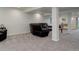 Spacious finished basement area featuring plush carpeting, neutral walls, and a comfortable leather sectional sofa at 10609 Chadsworth Ln, Highlands Ranch, CO 80126