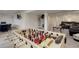 Finished basement rec room, featuring a foosball table, leather seating, decor, and a mounted television at 10609 Chadsworth Ln, Highlands Ranch, CO 80126