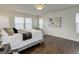Bright bedroom features sleek hardwood floors and a large window for natural light at 10609 Chadsworth Ln, Highlands Ranch, CO 80126
