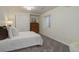Bedroom with plush carpet, neutral walls, and a comfy bed with closet and drawers at 10609 Chadsworth Ln, Highlands Ranch, CO 80126