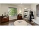 Secondary walk-in closet with mirror, furniture, natural light, and space for storage at 10609 Chadsworth Ln, Highlands Ranch, CO 80126