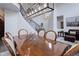 Bright dining room featuring dark wood floors, high ceilings, and a modern light fixture at 10609 Chadsworth Ln, Highlands Ranch, CO 80126