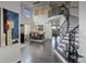 Open dining room features a high ceiling, large windows, and decorative staircase at 10609 Chadsworth Ln, Highlands Ranch, CO 80126