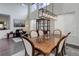 Dining room features high ceilings, dark wood floors, and a modern light fixture at 10609 Chadsworth Ln, Highlands Ranch, CO 80126