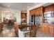 Spacious kitchen with stainless appliances, granite counters, hardwood floors, and an island at 10609 Chadsworth Ln, Highlands Ranch, CO 80126