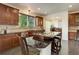 Charming kitchen featuring granite counters, tile backsplash, stainless appliances, and barstool seating at 10609 Chadsworth Ln, Highlands Ranch, CO 80126