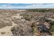 Aerial showcasing home in a natural setting with surrounding scrub brush and trees at 4249 Oak Grove Way, Castle Rock, CO 80108