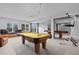 Billiards and workout equipment in a finished basement rec room at 4249 Oak Grove Way, Castle Rock, CO 80108