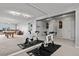 Home gym and billiards area reflected in a mirrored basement wall at 4249 Oak Grove Way, Castle Rock, CO 80108