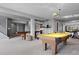 Finished basement offers billiards, shuffleboard, and an exercise area at 4249 Oak Grove Way, Castle Rock, CO 80108