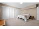 Carpeted bedroom with three closets and neutral walls offering storage space at 4249 Oak Grove Way, Castle Rock, CO 80108