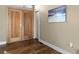 Inviting entryway featuring hardwood floors, double doors, and a decorative art piece at 4249 Oak Grove Way, Castle Rock, CO 80108