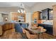 Kitchen with island and wood cabinets at 4249 Oak Grove Way, Castle Rock, CO 80108