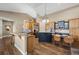 Kitchen with custom cabinets, stainless appliances, and a spacious island at 4249 Oak Grove Way, Castle Rock, CO 80108