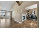 Spacious living area with hardwood floors, fireplace, and lots of natural light at 4249 Oak Grove Way, Castle Rock, CO 80108