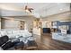 Open living room featuring a fireplace, vaulted ceilings, and modern furnishings at 4249 Oak Grove Way, Castle Rock, CO 80108