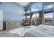 Inviting main bedroom with a stylish dresser, chair and balcony access through sliding glass doors at 4249 Oak Grove Way, Castle Rock, CO 80108