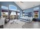 Bright main bedroom featuring vaulted ceiling, balcony access, and large windows offering scenic views at 4249 Oak Grove Way, Castle Rock, CO 80108