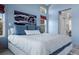 Comfortable main bedroom showcasing plush bedding and a tranquil atmosphere with large window and artwork at 4249 Oak Grove Way, Castle Rock, CO 80108