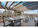 Covered outdoor deck with comfortable seating, ideal for relaxation and enjoying scenic views at 4249 Oak Grove Way, Castle Rock, CO 80108
