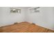 Bright bedroom features hardwood floors and natural light from the two windows at 6613 Independence St, Arvada, CO 80004