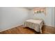 Cozy bedroom with hardwood floors and a comfortable bed at 6613 Independence St, Arvada, CO 80004