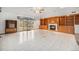 Spacious living room with built-in bookshelves, fireplace, and a large sliding glass door at 6613 Independence St, Arvada, CO 80004