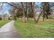 Picturesque park featuring walking paths, benches, and mature trees, a serene community space at 6613 Independence St, Arvada, CO 80004