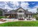 Expansive backyard featuring a covered patio with ample seating and dining area for outdoor entertaining at 9121 Sunshine Meadow Pl, Parker, CO 80134