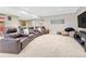 Spacious finished basement featuring a home theater area with comfortable seating and media console at 9121 Sunshine Meadow Pl, Parker, CO 80134