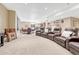A large finished basement with a seating area, game table, and bar area, perfect for entertaining at 9121 Sunshine Meadow Pl, Parker, CO 80134