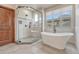 This is a luxury bathroom with a free-standing tub and separate walk-in shower at 9121 Sunshine Meadow Pl, Parker, CO 80134