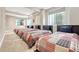 A spacious bedroom featuring four beds, making it ideal for a large Gathering or guest accommodation at 9121 Sunshine Meadow Pl, Parker, CO 80134