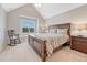 This secondary bedroom features a rocking chair and view of the outdoors at 9121 Sunshine Meadow Pl, Parker, CO 80134