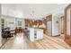 Open kitchen with granite countertops, island seating, and stainless steel appliances at 9121 Sunshine Meadow Pl, Parker, CO 80134
