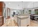Kitchen island with granite countertops, stainless steel appliances, open to the living room at 9121 Sunshine Meadow Pl, Parker, CO 80134