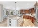 Bright, airy kitchen with a granite island, stainless appliances, and hardwood flooring at 9121 Sunshine Meadow Pl, Parker, CO 80134
