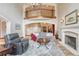 Spacious living room featuring fireplace, hardwood floors, and balcony overlook at 9121 Sunshine Meadow Pl, Parker, CO 80134