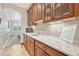 Butler's pantry area featuring cabinetry, granite countertop, and white subway tile backsplash at 9121 Sunshine Meadow Pl, Parker, CO 80134