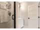 Modern bathroom with glass enclosed tiled shower, a white vanity, and a tile floor at 795 Pine Brook Rd, Boulder, CO 80304