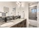 Bright bathroom features a double sink vanity with modern fixtures and an adjacent walk-in shower at 795 Pine Brook Rd, Boulder, CO 80304