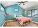 Colorful bedroom with book storage, large windows and vibrant accents at 795 Pine Brook Rd, Boulder, CO 80304