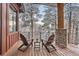 Inviting deck with Adirondack chairs and snow-covered mountain views, perfect for enjoying the outdoors at 795 Pine Brook Rd, Boulder, CO 80304