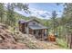 Stunning two-story home featuring a deck, porch, and mountain views at 795 Pine Brook Rd, Boulder, CO 80304