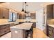 Modern kitchen with a large island, stylish pendant lights, and stainless steel appliances at 795 Pine Brook Rd, Boulder, CO 80304